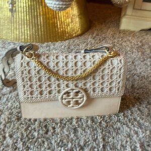 Tory Burch Miller basket weave small flap shoulder bag.